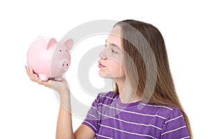 Young girl holding piggybank