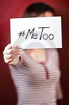 Young girl holding a sign supporting the  metoo campaign