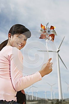 Young Girl Holding Toy Windmill