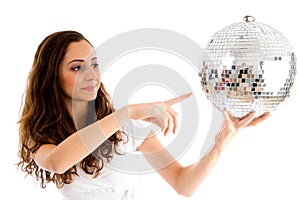 Young girl indicating disco ball