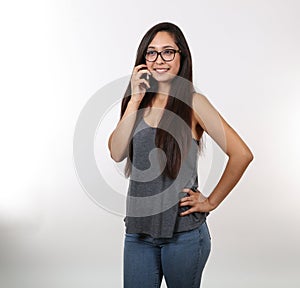 Young Girl Wearing Glasses Holds Phone And Smiles