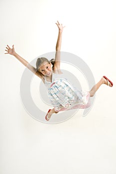 Young girl jumping for joy