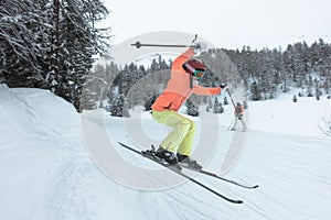 Young girl jumping on skis
