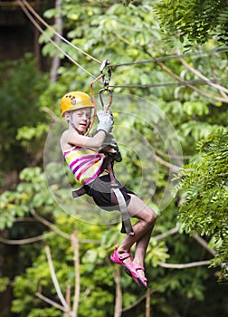 Young girl on a jungle zipline