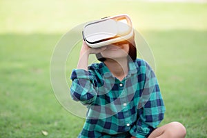 Young girl kid child play virtual reality game hold vr glasses and surprised. Cyber space and virtual gaming .SSTKHome