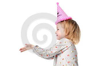 Young girl kid happy smiling and show hands with free text copy space in birthday party pink cap