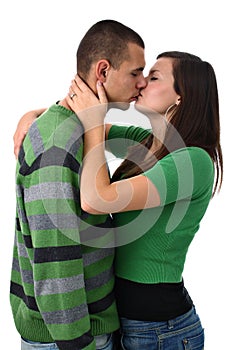 Young girl kisses and hugs her boyfriend isolated