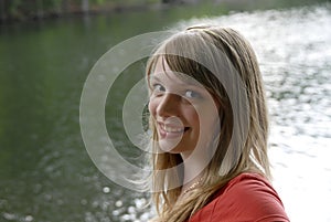 Young girl with lake behind her