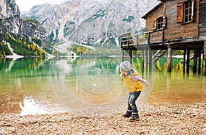 Young girl on Lake Bries in the autumn skipping stones