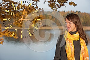 Young girl on lake coast. Sunny Autumn Day