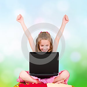 A young girl with a laptop