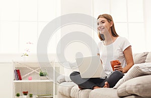 Young girl with laptop indoors
