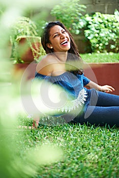 Young girl laugh on grass