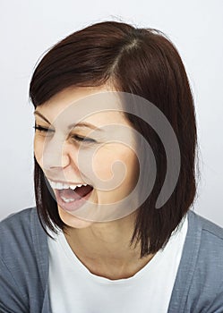 Young girl laughing sincerely