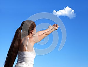 A young girl is launching a cloud