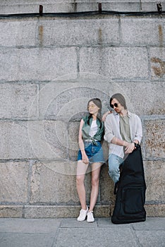 Young girl leaning on man