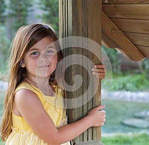 Young Girl Leaning on a Post