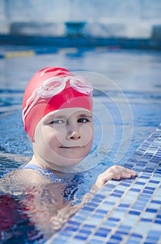 Young girl learning to swim