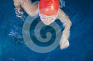 Young girl learning to swim