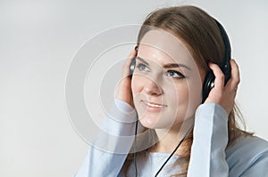 Young girl listen to music on headphone