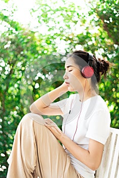 Young girl listen to music from headphone