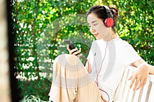Young girl listen to music from headphone