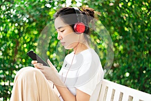 Young girl listen to music from headphone