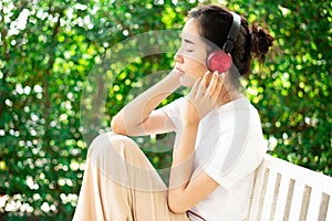 Young girl listen to music from headphone