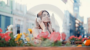 Young girl listen to music on headphones