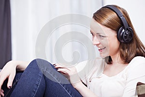 Young girl listen to music with headphones