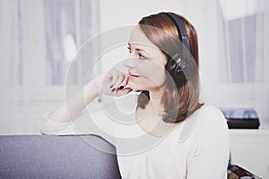 Young girl listen to music with headphones