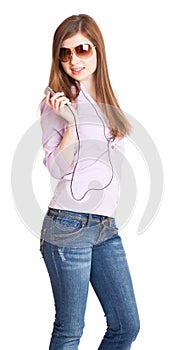 Young girl listening to music om mp3 player photo