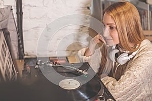 Young girl listening to a record