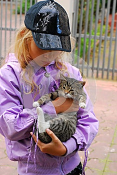 Young girl with little kitten