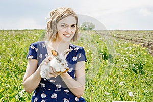 Young girl with a little rabbit. photo