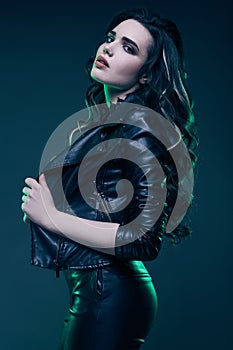 Young girl with long hair in leather jacket