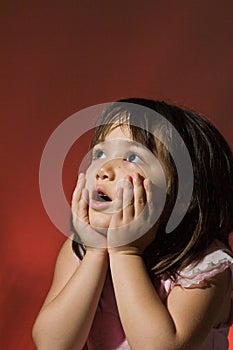 Young girl looking in awe photo