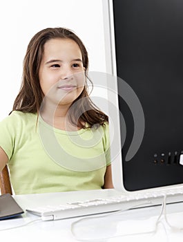 Young girl looking at computer