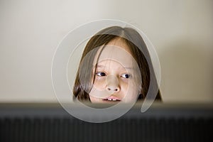 Young girl looking at computer screen