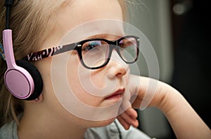 Young girl looking at laptop screen