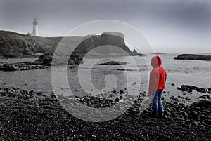 Young Girl Looking at Lighhouse