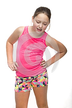 A young girl looking sweaty and tired from exercise. photo