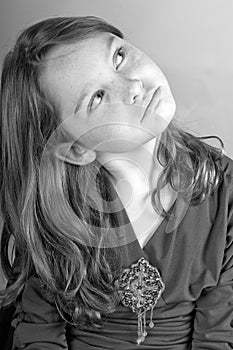 Young girl looking up