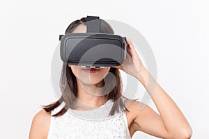 Young girl lookinh with VR device