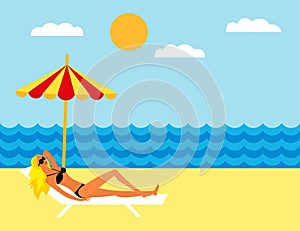 Young girl lying on the beach under an umbrella. Girl sunbathing on a deckchair on the beach