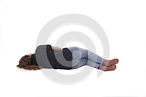 young girl lying on the floor on white background