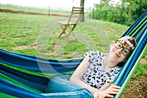 Young girl lying in hammock