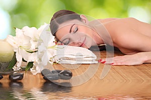 Young girl lying in a spa