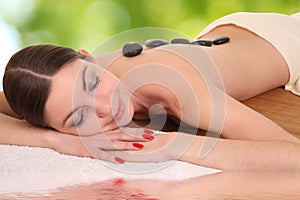 Young girl lying in a spa