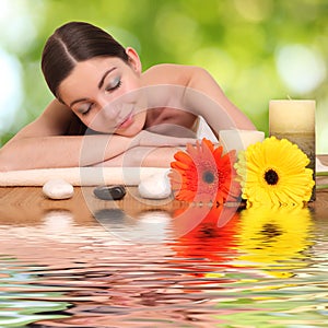 Young girl lying in a spa